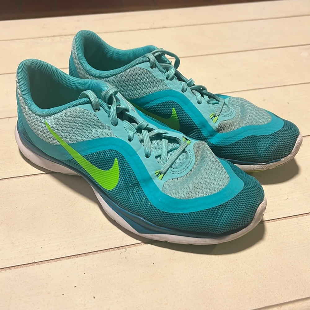 Blue and green Nike tennis shoes